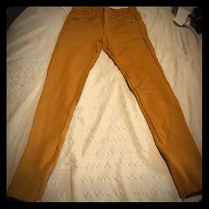 Camel color pants that stretch with ankle zippers